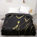 housse de couette noire et dorée